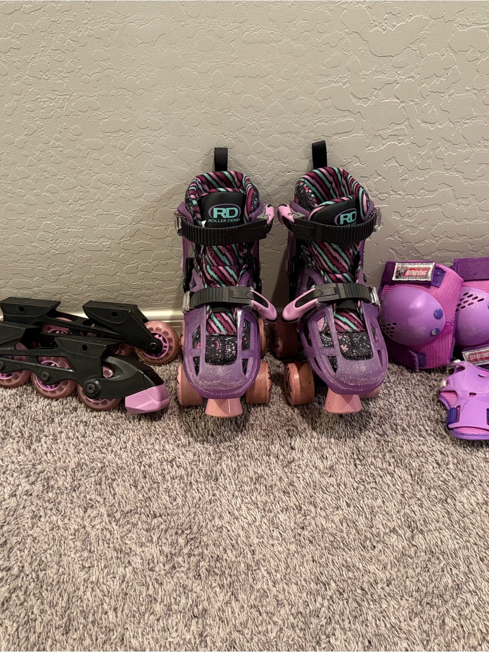 Girls' Adjustable Purple Quad Roller Skates with Protective Pads
